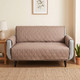 tan couch cover in a living room