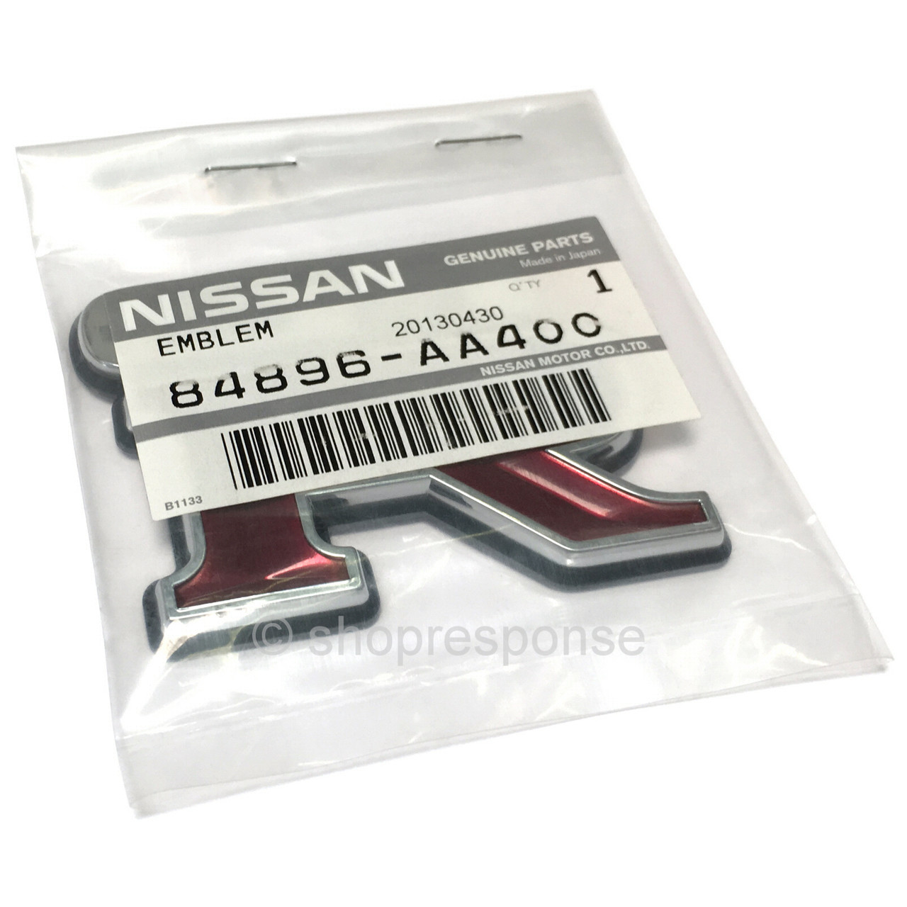 JDM Genuine Nissan Skyline GT-R R34 Rear Emblem - OEM 84896-AA400 (Red, Plastic)