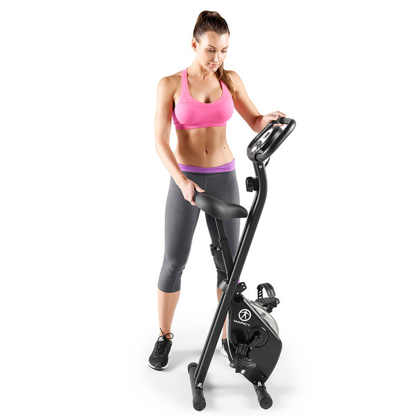 Model with the Marcy Foldable X Bike in Black NS-654 folded