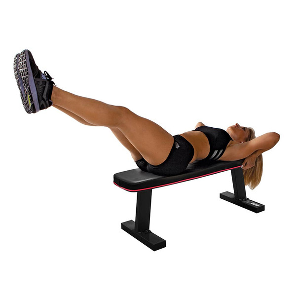 The Marcy SB-10510 Flat Bench utilized by model to do leg lifts