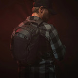 Vertx Urban Ghost 10L Sling Bag, Black, Shown on Back of Person Facing Back Right Corner