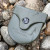 Brunton Weather-Resistant Transit Case with Snap Closure, Shown Against Rocks