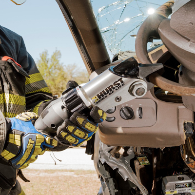 Hurst Mini Cutter being used on the steering wheel of a demo crashed car.