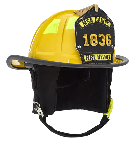 MSA Cairns 1836 - Yellow helmet with black earflaps. Side angle view.