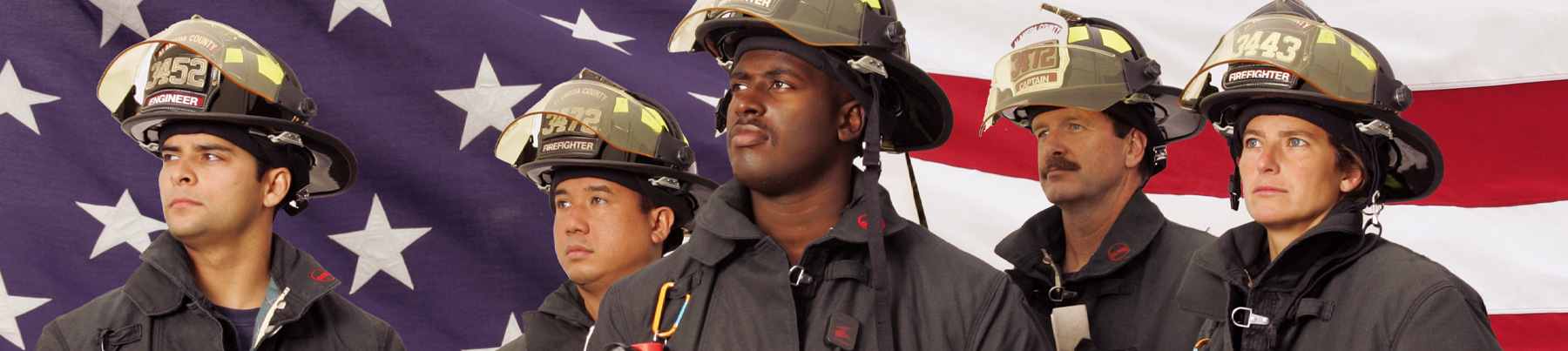 Firefighters in front of American Flag