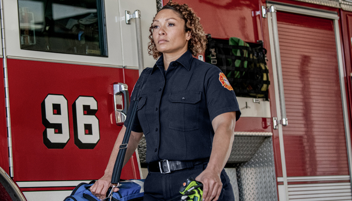 Woman firefighter in navy blue uniform