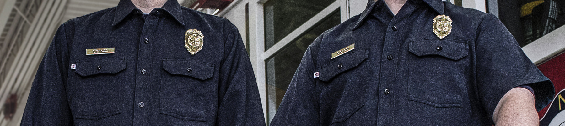 Closeup image of a firefighters navy blue uniform shirt.