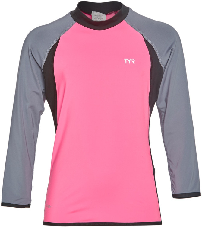 Stay protected from the sun with the vibrant, fun TYR Girls' UPF 50+ Long Sleeve Solid Rashguard. Every little girl will just love the comfortable design and vivid style of this cute, colorful swim shirt.

Fabric & Care
88% Polyester, 12% Spandex.
Rinse after each use.
Details
Girls' rash guard.
Long-lasting material.
UPF 50+ sun protection.
Durafast Lite 200+: - 200+ hours of use. - 30% lighter weight than Durafast Elite. - 360-degree range-of-motion.
Sizing & Fit
Sized for 4-16 years.
Long raglan sleeved.
Lightweight feel for unrestricted comfort.
Country of Origin
Imported