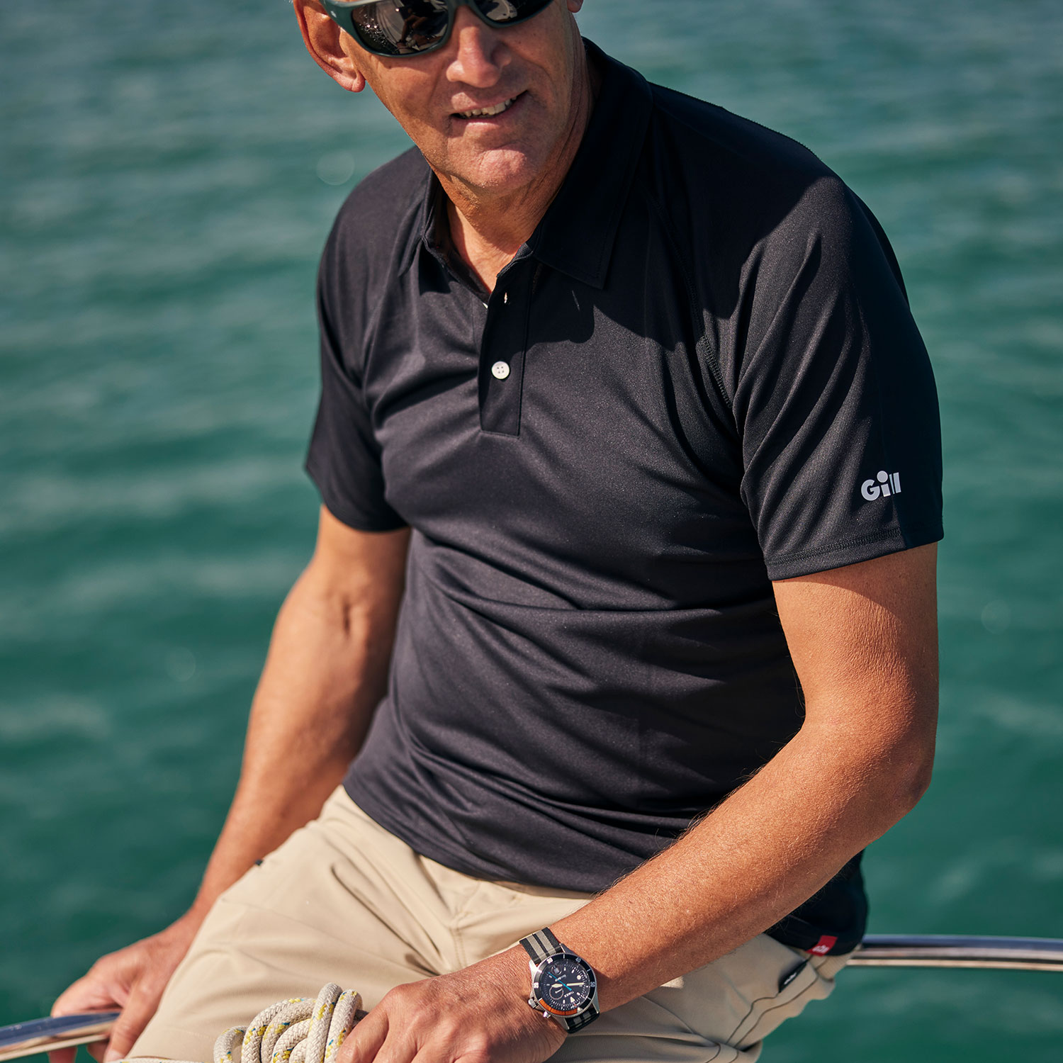 Men's UV Tec Polo - UV008-BLK01-LIFESTYLE-3.jpg