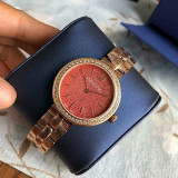 Swarovski Women's Glittering Coral Daytime Bracelet Watch in Rose Gold 