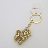 Small Gold-Tone Poodle Dog Keychain with Black Bowtie