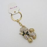 Small Gold-Tone Poodle Dog Keychain with Black Bowtie