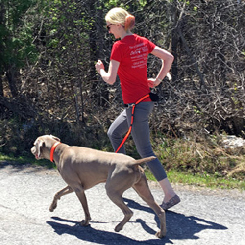 Girl jogging with Smoochy Poochy hands free leash