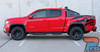 Side View of Chevy Colorado with Antero Graphics – Full side profile of a red Chevy Colorado fitted with bold Antero vinyl graphics on the bed. Precision-cut stripe kit for a rugged, custom truck appearance.