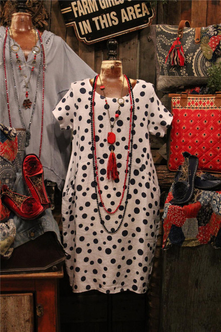 Women's white linen dress with navy polka dots