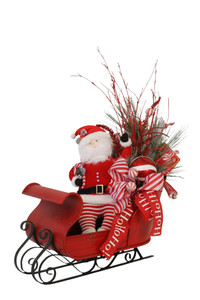 Red Metal Sleigh Decorated With Santa