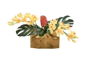 Tropical Mix of Champagne Burgundy Orchids and Protea in a Gold Ritz Vase