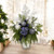 Blue Hydrangeas with Drooping Pine and Glitter Accents in Silver Vase