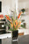 Waterlook® Mixed Tropical Flowers and Foliage in Leopard Vase