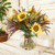 Waterlook® Wild Flowers Mixed with Sunflowers and Berries in Amber Smoke Vase