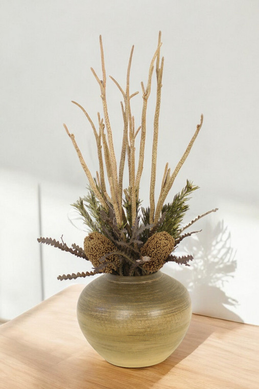 Protea's with Platys Cones and Foliage in Green Vase