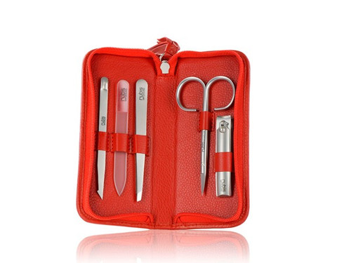 Classic slant eyebrow tweezers, Classic fingernail scissors, nail clippers, Push&Clean for nail cleaning, nail file made of smallest glass beads, packed in a red genuine leather case.