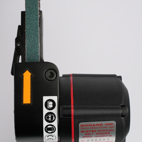 Shinano SI-2740 air belt sander showcasing 10mm belt drive system, comfortable rubber hand grip, and adjustable angle belt arm