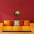 "Days End" Airbrushed Canvas with 3D Wood Eagle Detail in Living Room with red wall above orange sofa