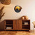 "Days End" Airbrushed Canvas with 3D Wood Eagle Detail in Living Room with beige wall above rustic wood shelving unit