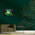 "Green Tree Frog on Lilypad" Airbrushed Canvas in Living Room with hunter green wall above khaki armchair