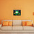 "Green Tree Frog on Lilypad" Airbrushed Canvas in Living Room with orange wall above beige sofa with orange accents