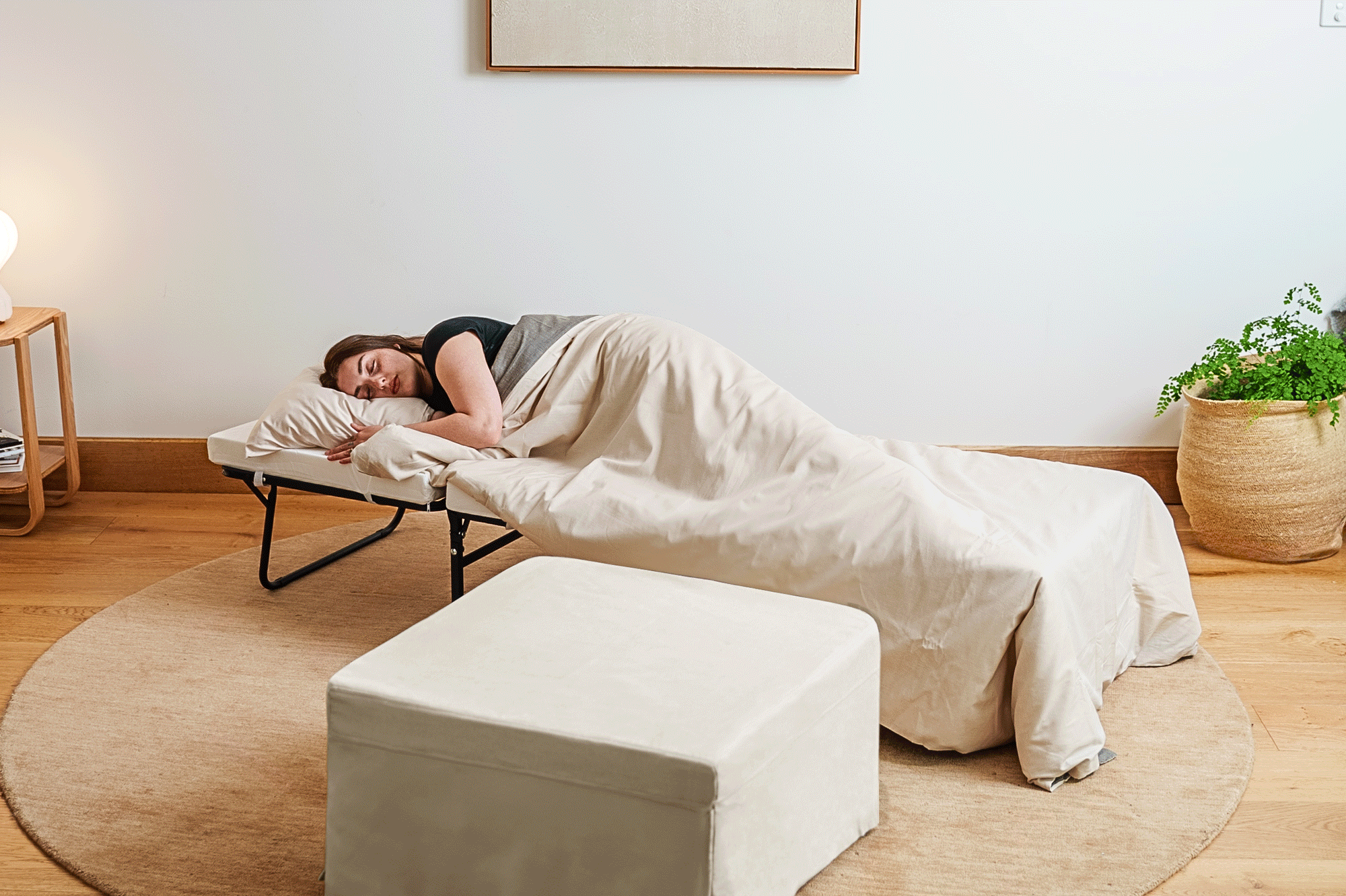Ottoman folding into bed