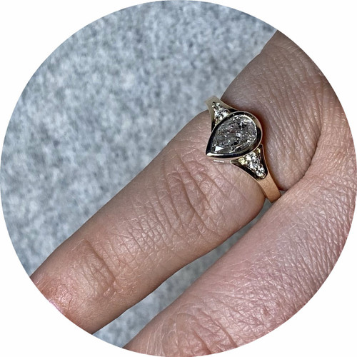 Brendan Cunningham- Salt and pepper 1.15ct pear cut diamond. 0.06ct GH SI side stones. 9ct yellow and white gold. size K1/2 Brendan Cunningham- Salt and pepper 1.15ct pear cut diamond. 0.06ct GH SI side stones. 9ct yellow and white gold. size K1/2