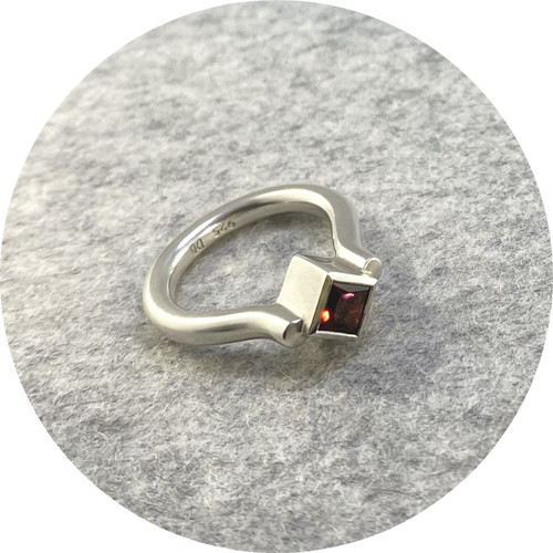 Danielle Barrie - 'Regal Ring' Made in Sterling Silver and set with a Garnet Danielle Barrie - 'Regal Ring' Made in Sterling Silver and set with a Garnet
