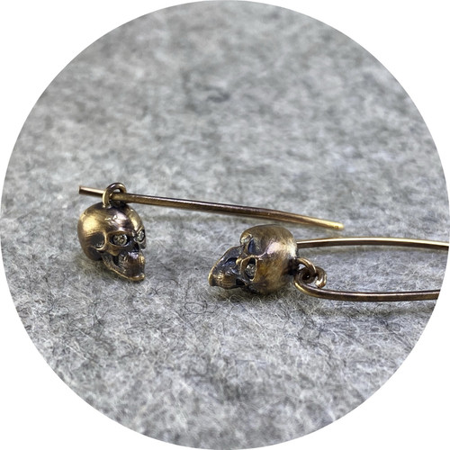 Brendan Cunningham- 9ct yellow gold skull drop earrings with diamond eyes. Brendan Cunningham- 9ct yellow gold skull drop earrings with diamond eyes.