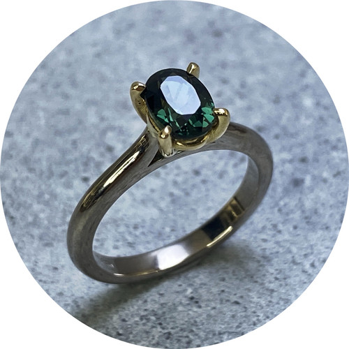 KIN- 18ct yellow gold white gold engagement ring. Oval Australian teal sapphire 1.23ct. size K.