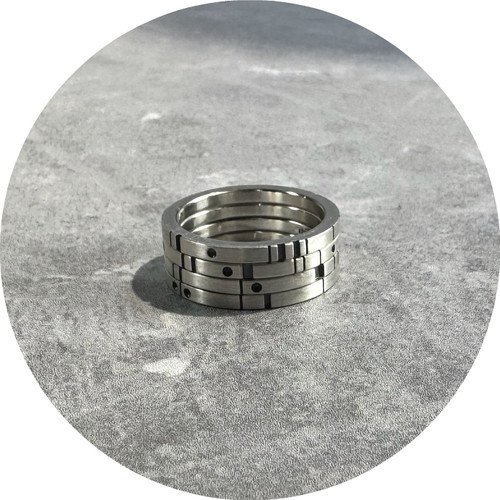 Cass Partington - "Metropolis V2 - 4 Stack" 4 Sterling Silver Rings ; Each Band 2mm x 2mm ; With Metropolis Design Of Lines, Recesses And Dots. Size O 1/4