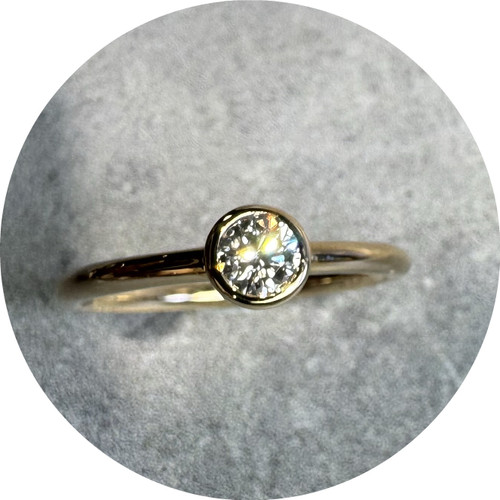 KIN - 9ct Yellow Gold Bezel Set Diamond Solitaire. Size M