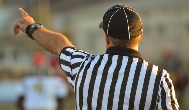 A referee on the field pointing