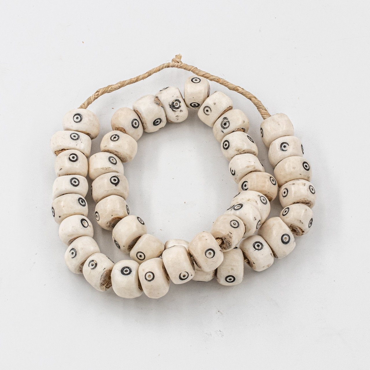 White Drum Eyes Kenya Cow Bone Beads Per String