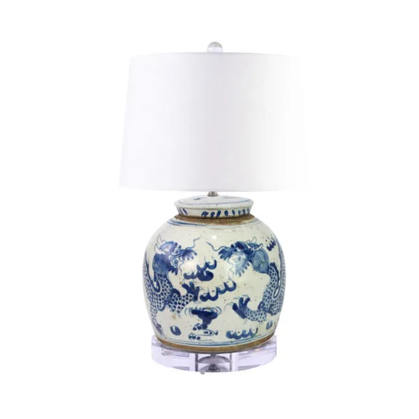 Porcelain-base table lamp with a blue dragon motif and white shade