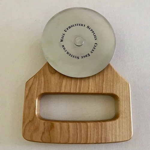 Fabric roller tool for fabric mounting track
