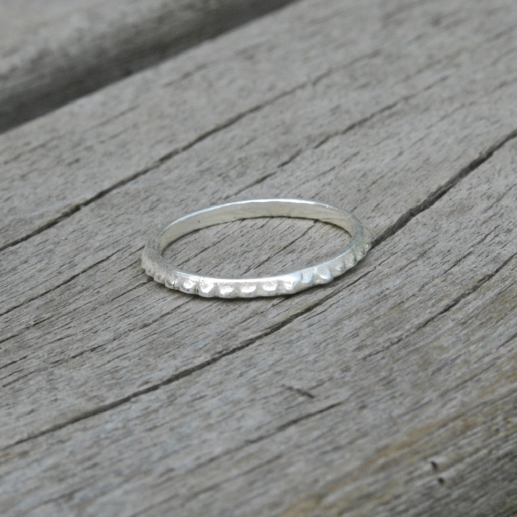 delicate simple sterling silver stacking ring with a bit of edge