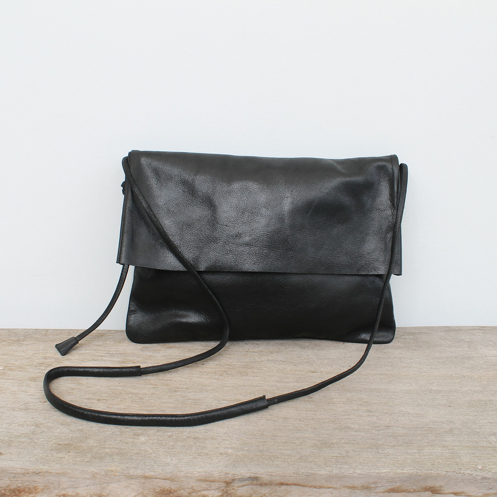 black genuine leather fold over crossbody bag with minimalist adjustable strap