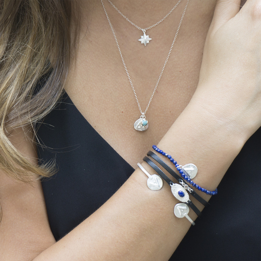 silver 'transition' charm necklace with turquoise stone detail