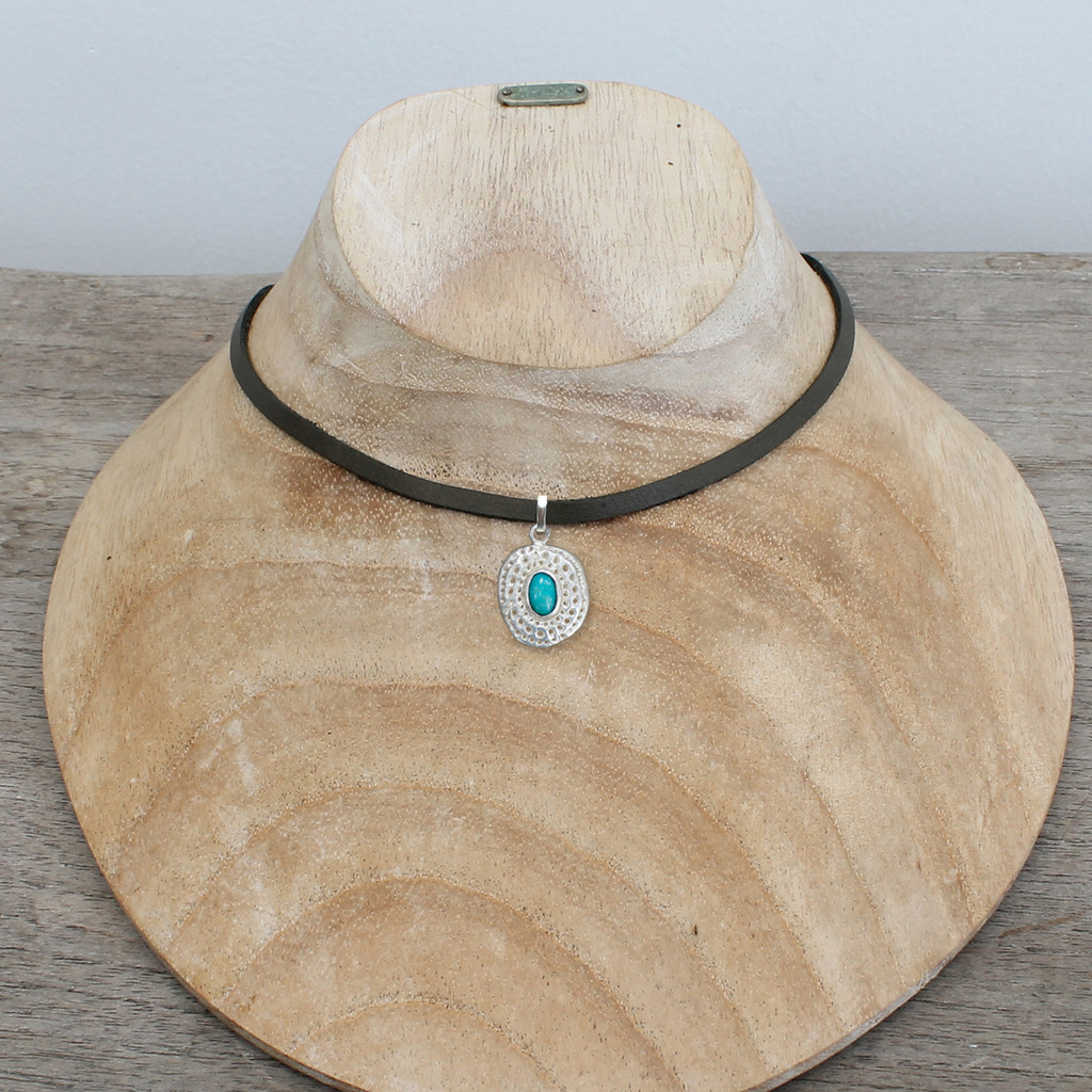Grey leather with silver plated pendant featuring turquoise stone