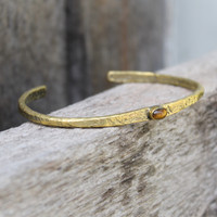 Brass thin cuff with tiger's eye inset stone