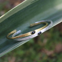 Brass thin cuff with black agate inset stone and silver thin cuff with black agate inset stone