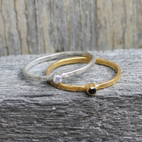 Sterling silver and 14 carat gold plated sterling silver rings with solitaire black and white stones
