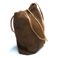 cognac leather tote bag with simple tab closure